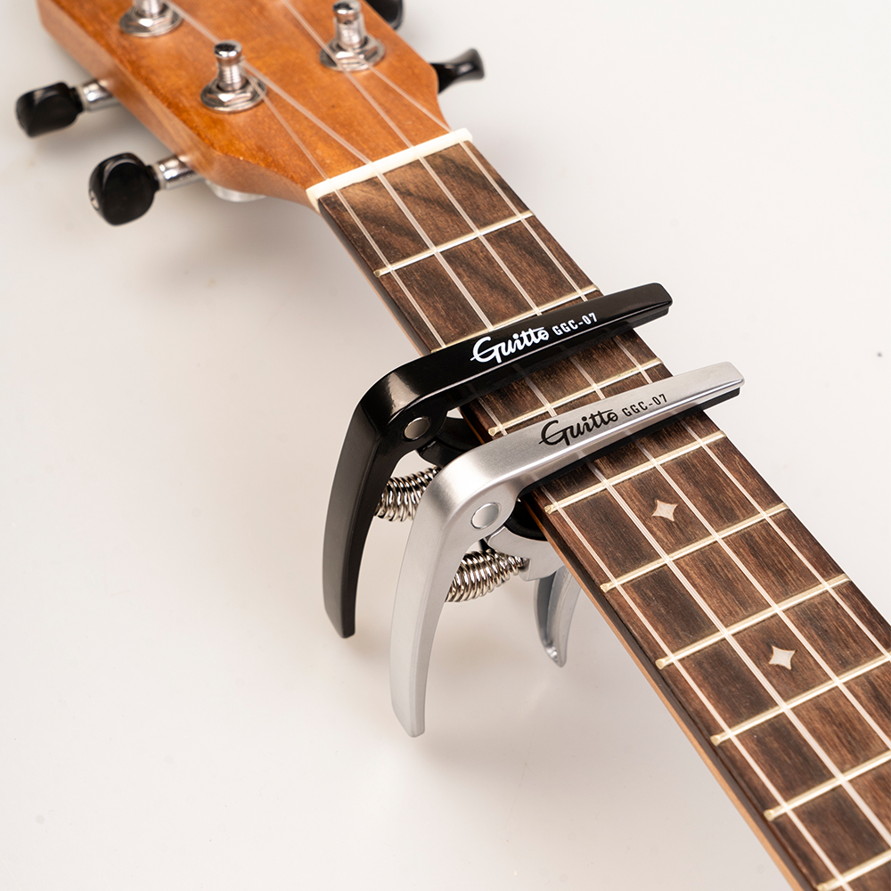 GUITTO GGC-07 Ukulele Capo Qui - مراجعة Musical Instrument Types وسعره