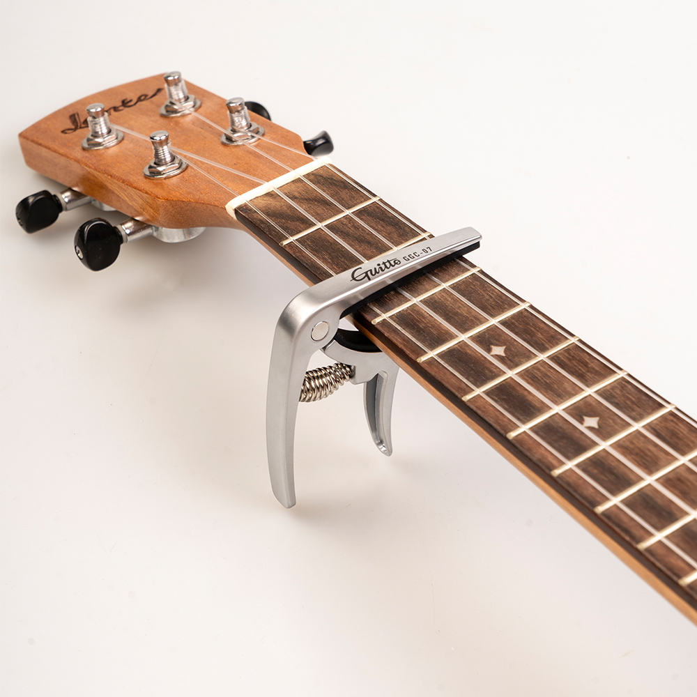 GUITTO GGC-07 Ukulele Capo Qui - مراجعة Musical Instrument Types وسعره